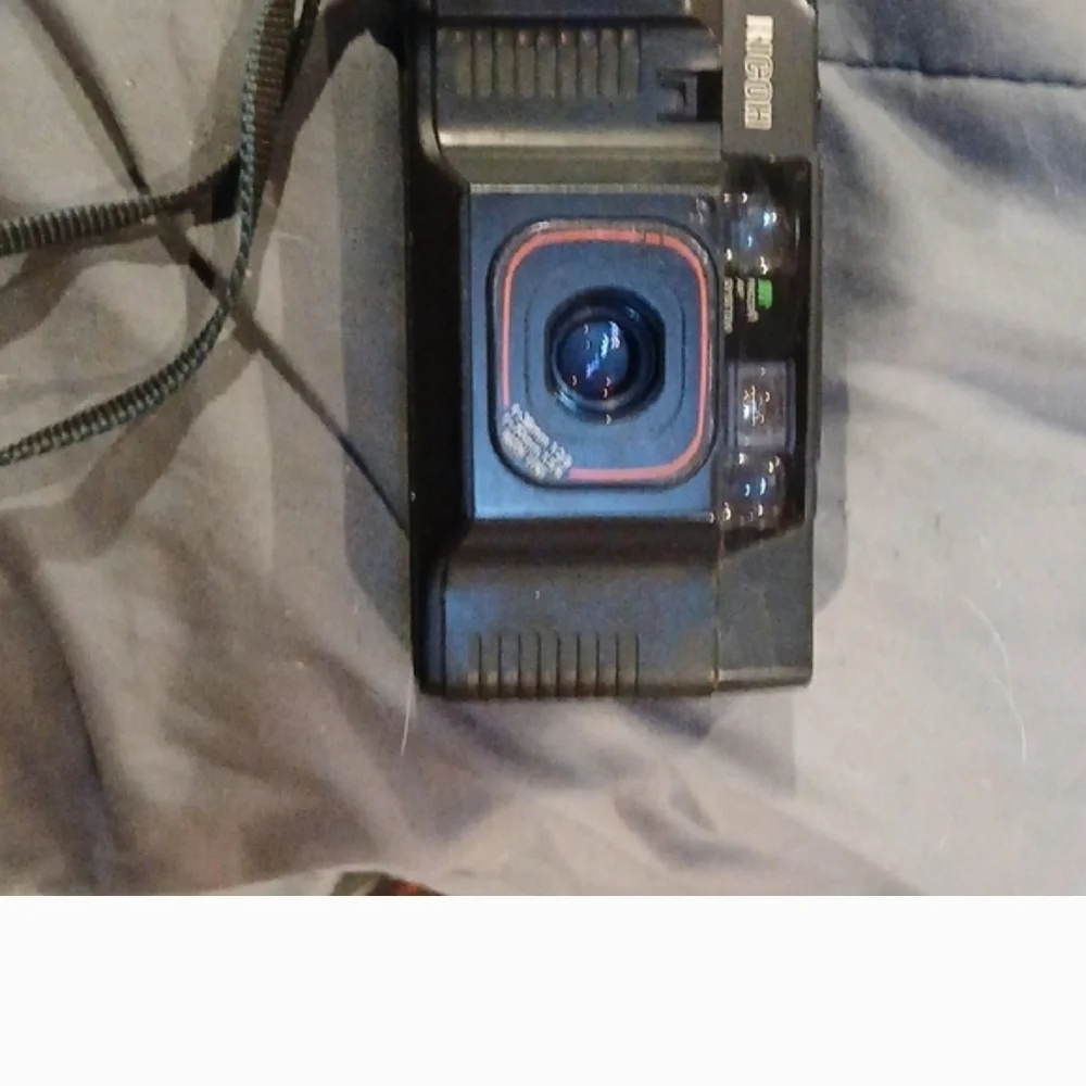 Nikon Black Film Camera with Red Accents